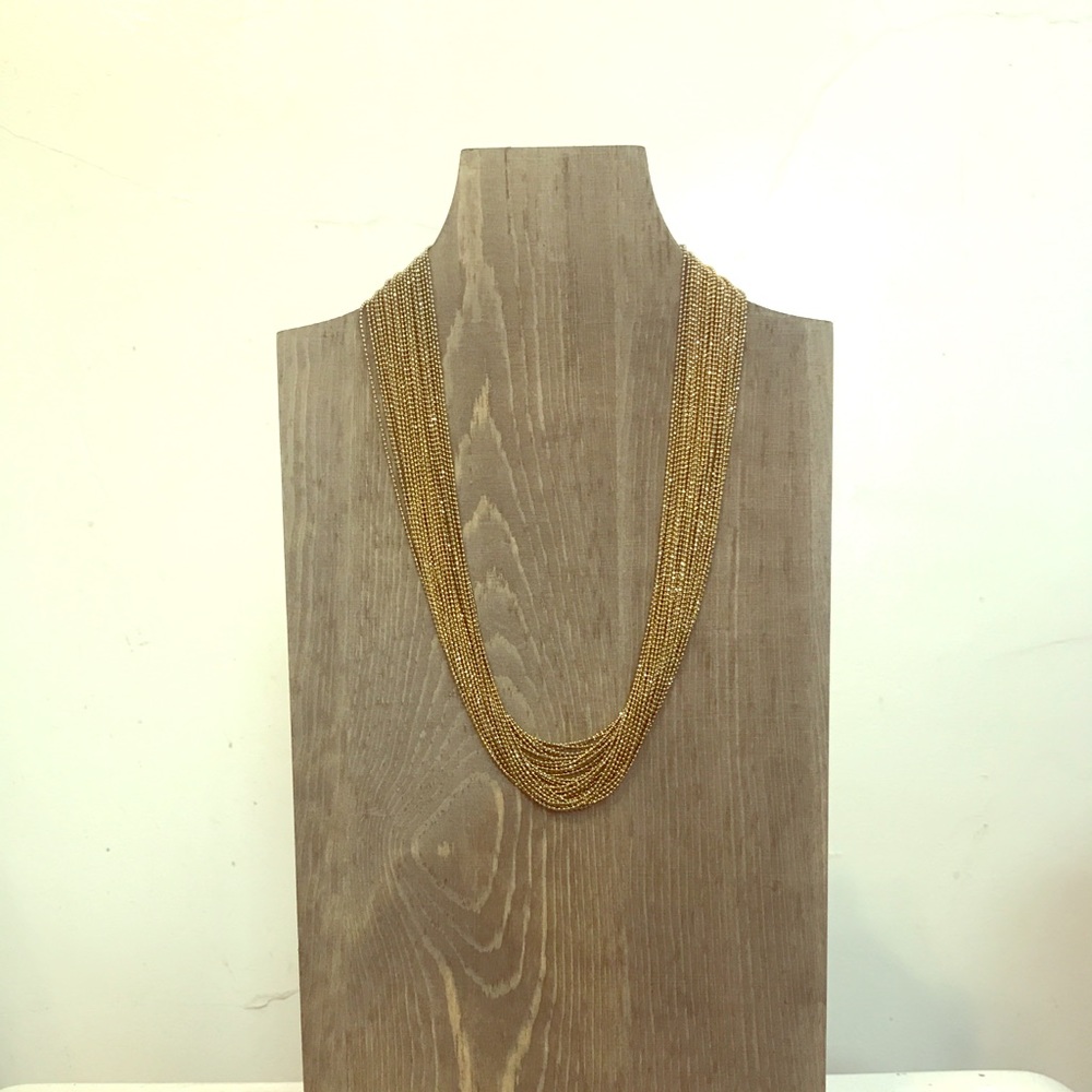 Multi strand dark gold colored necklace